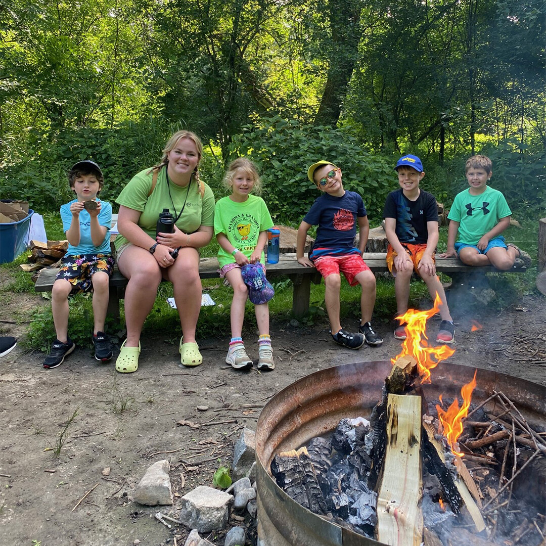 Acorn camp kids by fire pit